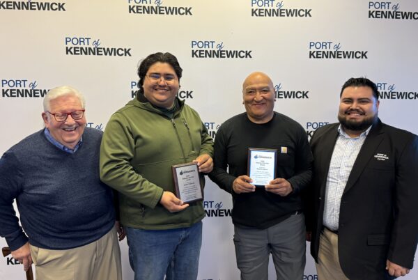 Port Commissioners Skip Novakovich (left) and Raul Contreras Gonzalez (right) presented Daniel Tlatenchi (center left) and Ricardo Garza with commemorative plagues, recognizing them for their outstanding service to the port and the community.