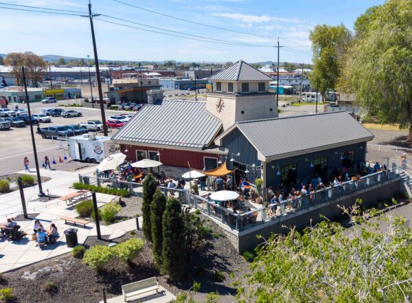 An aerial of the building Brandi Dayton Art and Wheat Head on the Water share at Columbia Gardens Artisan Village.