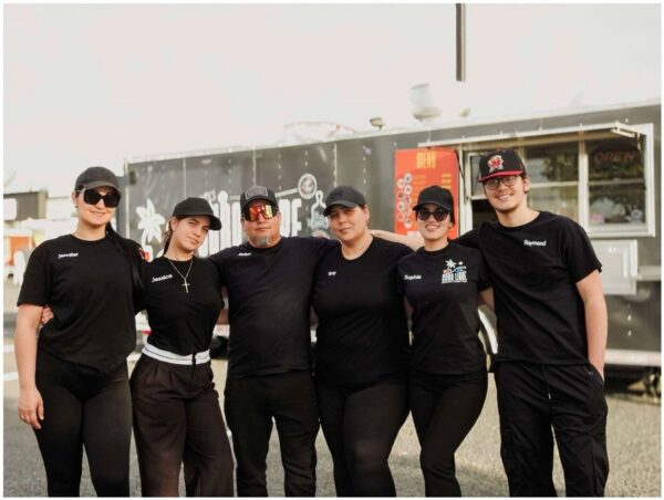 Cuba Libre food truck owners Rafael Najarro and his wife, Yeny, flanked by their four children.
