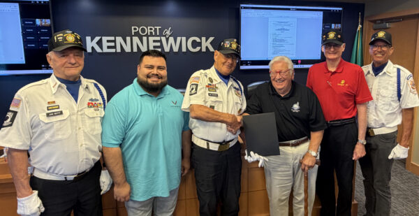 Port of Kennewick Commissioners Skip Novakovich (third from right) and Raul Contreras Gonzalez (second from left) present the proclamation to Purple Heart recipient and Army veteran Don Wicks (center) and other members of local VFW Post 5785 (from left) Army veteran Jim Witt, Marine veteran Kevin Veleke and Navy veteran Mike Dotson.