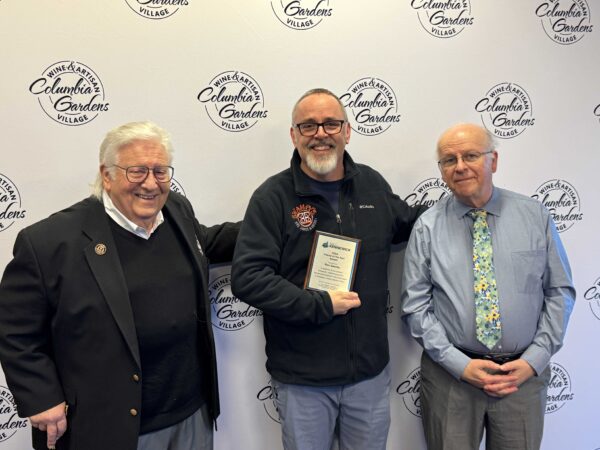 Port of Kennewick Commissioners Skip Novakovich (left) and Thomas Moak (right) stand with Ron Swanby, a 2024 “Friends of the Port” Award honoree.