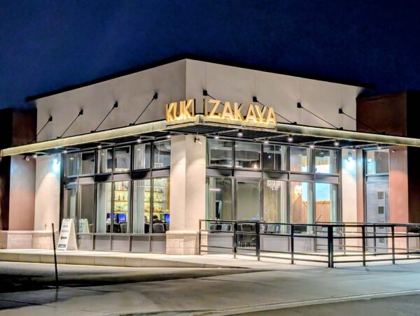 Nighttime exterior of the KUKI Izakaya restaurant at Vista Field.