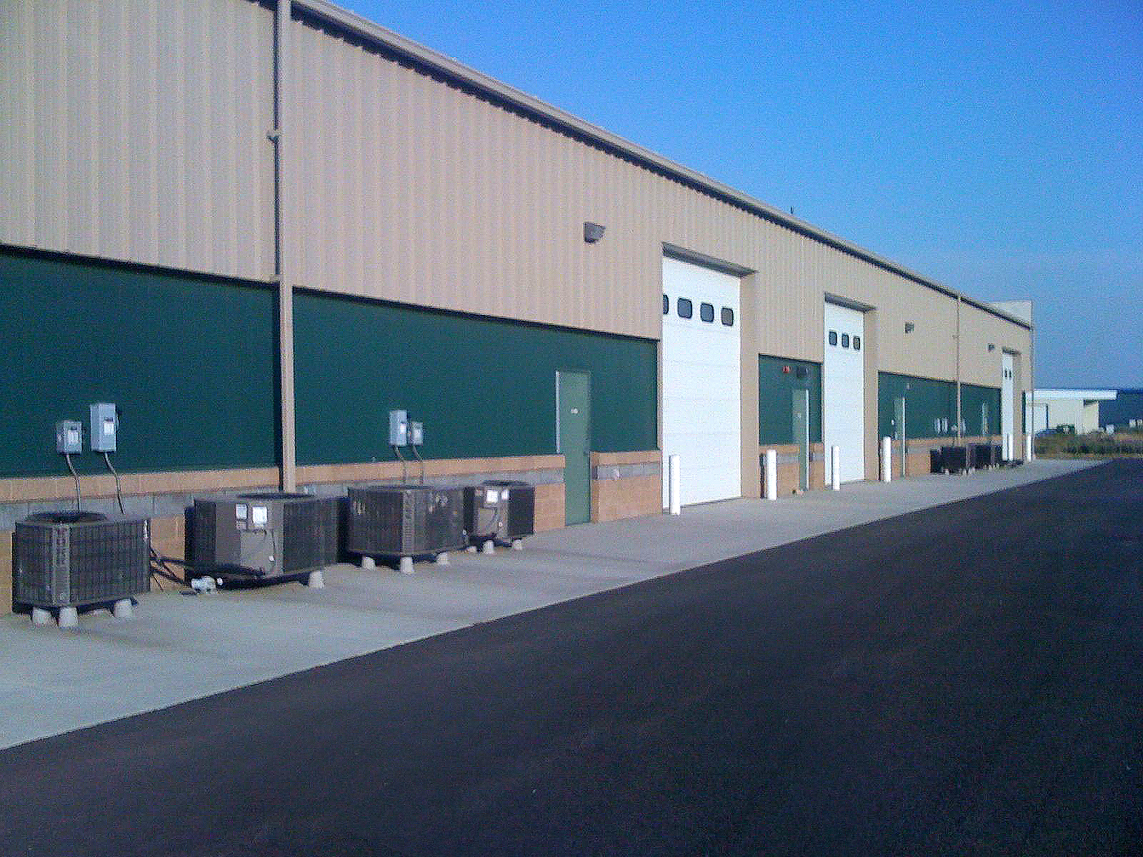 Ground-level exterior of the rear roll-up doors of the Oak Street Industrial Park Development Building C.