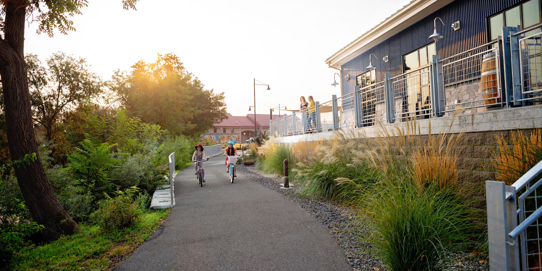 Bicyclist riding along the Columbia Gardens pathway.