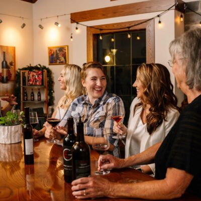 Gordon Estate Winery owner visits with guests at the Columbia Gardens tasting room.